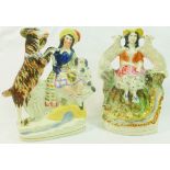 Two Stafforshire pottery flatback groups of a shepherdess sat by a stream with a sheep resting on