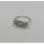 A diamond three-stone ring, the centre round brilliant cut stone approximately 1.