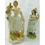 A Victorian Staffordshire pottery flatback figure of a huntress, holding a bird of prey,