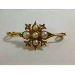A Victorian gold, rose cut diamond and half pearl set star burst bar brooch, 4.25cm long, 3.