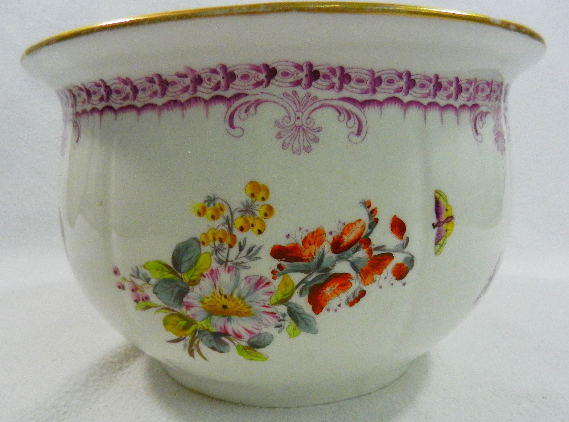 A 19th century porcelain chamber pot with printed and painted decoration of floral sprays and - Image 9 of 9