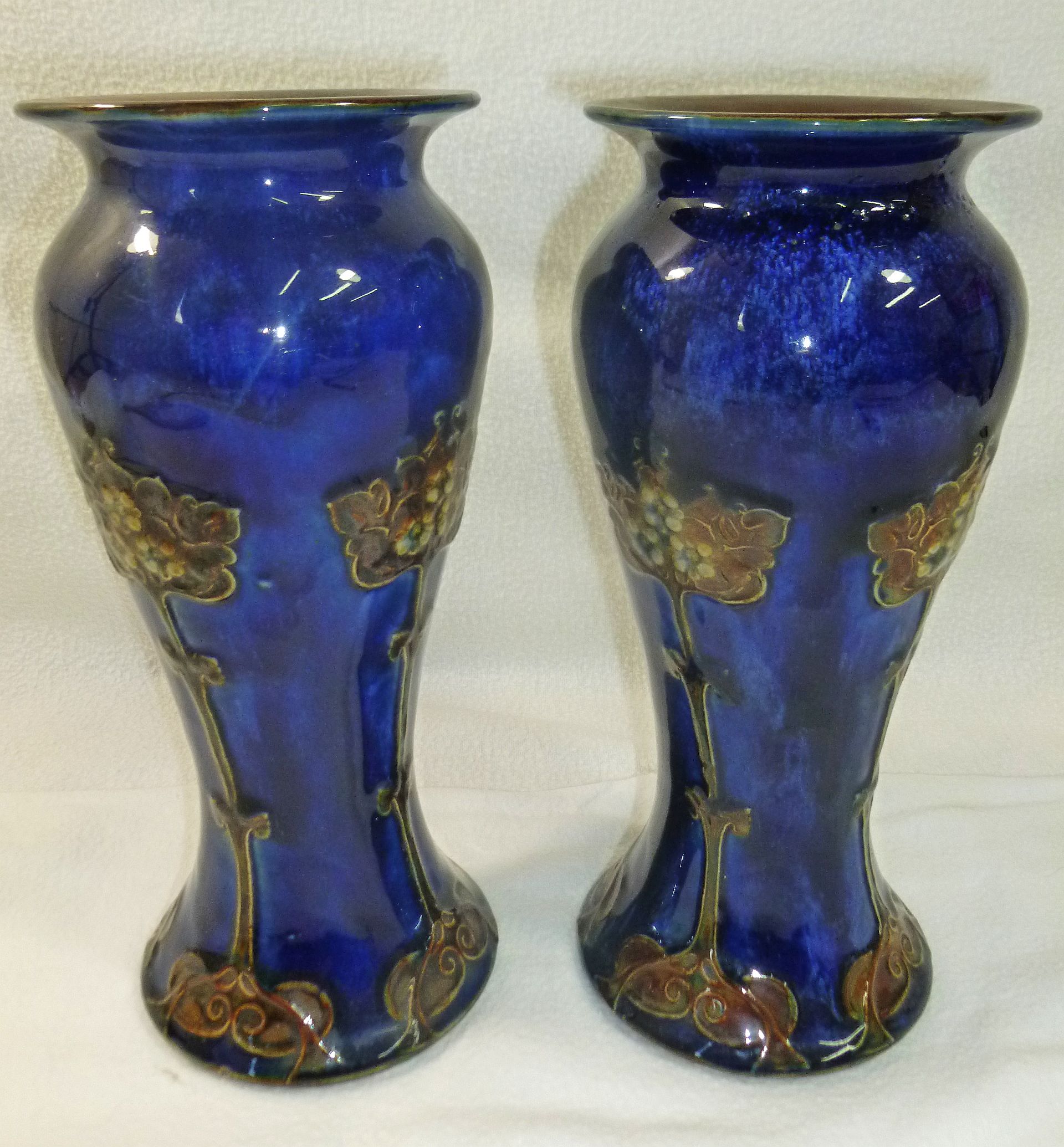 A pair of Royal Doulton Art nouveau stoneware vases with inscribed initials 'EB',