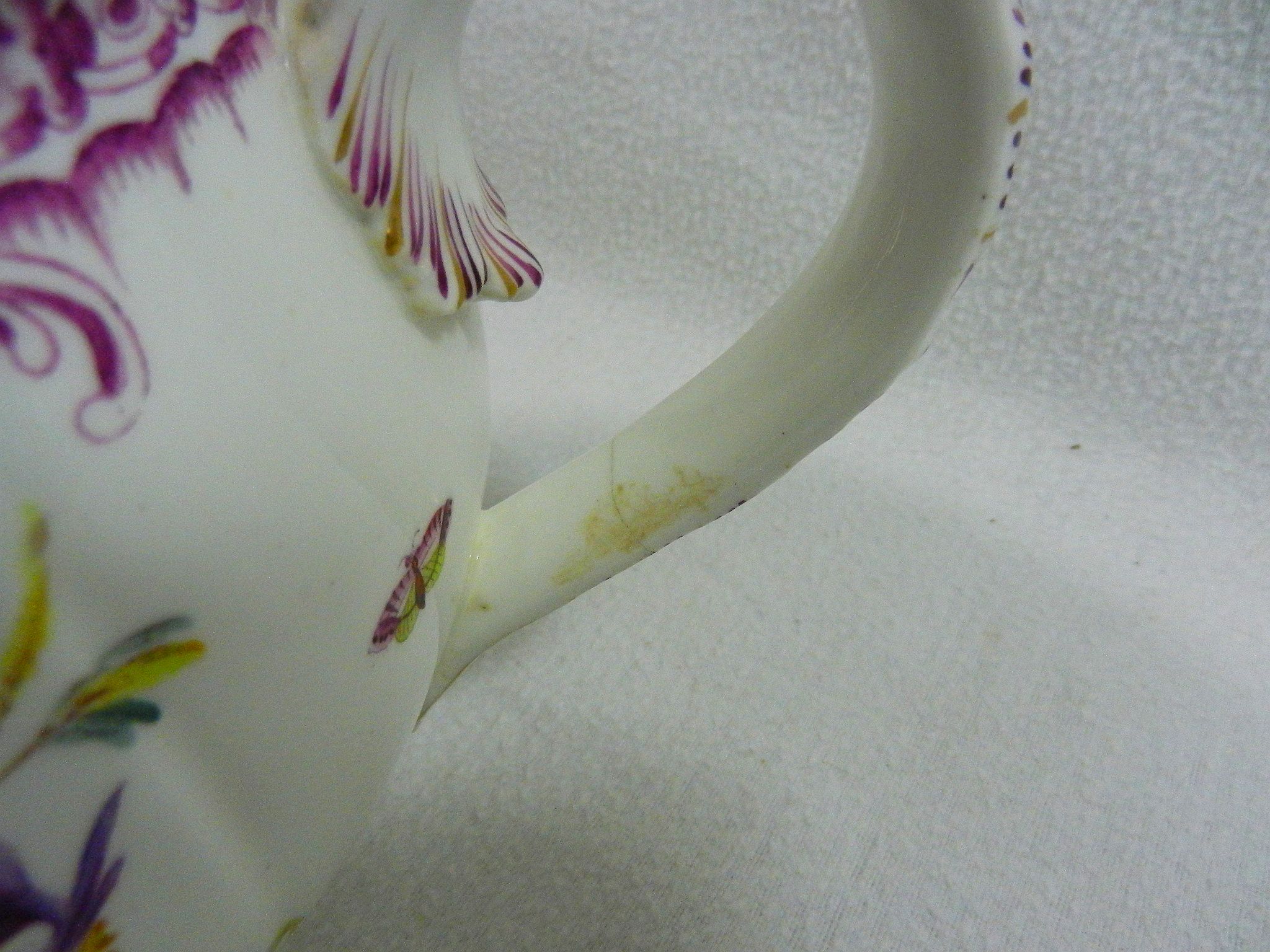 A 19th century porcelain chamber pot with printed and painted decoration of floral sprays and - Image 6 of 9