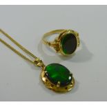 A 14 carat gold abalone set ring and a yellow metal abalone set pendant stamped '14K',
