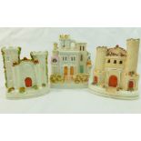 Three Staffordshire pottery flatback pastille burners in the form of castles, 18.5cm, 17cm and 14.