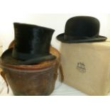 A small silk top hat by Macqueen and Co.