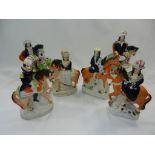 Two pairs of Staffordshire pottery figures on horseback and two other Staffordshire horse and rider