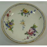 An 18th century Sevres porcelain saucer, hand painted with floral sprays, with gilt rim,