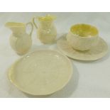 Five pieces of Belleek porcelain comprised of a cream jug and sugar bowl with black printed second