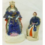 A Victorian Staffordshire pottery figure of Queen Victoria seated upon her throne, 19cm high,
