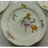 A set of four 19th century Meissen porcelain plates with basket weave moulded rims,