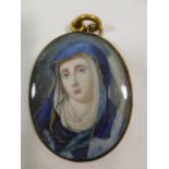 An 18th century oval portrait miniature on ivory of the Virgin Mary, signed Downes and dated 1766,