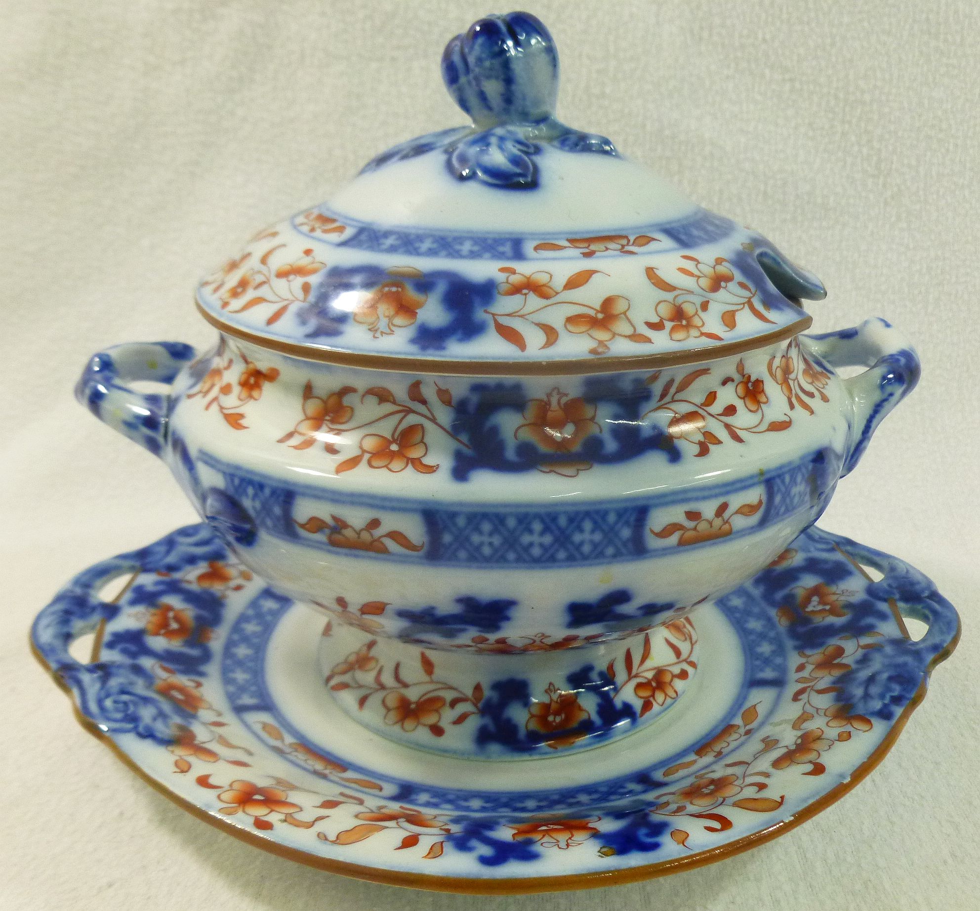 A Minton earthenware sauce tureen, lid and stand with cobalt blue and ironstone red decoration,