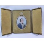 An 18th century oval portrait miniature of a gentleman, in ermine trimmed coat,