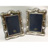 A pair of ornate rectangular silver phot