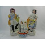 A large pair of Staffordshire figures of