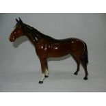 A Beswick bay horse, 24.5cm long, 21cm h