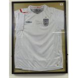 OF FOOTBALL INTEREST England shirt signed Peter Beardsley.