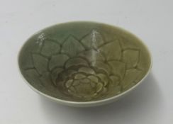 A celadon style stem bowl, the centre moulded with flower design impressed Grubb to the base,