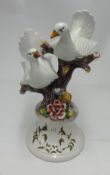 Capo di Monte  A large vintage centrepiece modelled as a pair of doves on a tree, height 48cm.