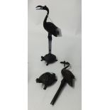 A pair of Japanese bronze storks, stood on a turtle, height 24cm.