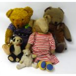 Collection of soft toys including teddy bears.