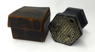 A concertina, probably Wheatstone, with pierced steel ends, with 56 keys and leather travel case.