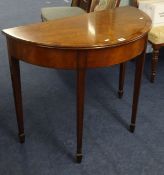 A mahogany and cross banded hall table fitted with a frieze drawer