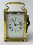 Brass case carriage clock with platform escapement and key, 11cm.