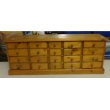 A pine bank of 20 drawers.