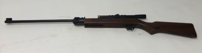 A Relum .22 air rifle, model 527, with telescopic sight.