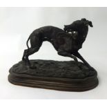 A bronze model of a Greyhound signed 'P.J. MENE' length 29cm x height 20cm.