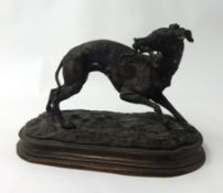 A bronze model of a Greyhound signed 'P.J. MENE' length 29cm x height 20cm.