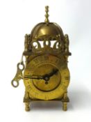 A reproduction small Smiths lantern clock height, 18cm.