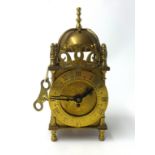 A reproduction small Smiths lantern clock height, 18cm.