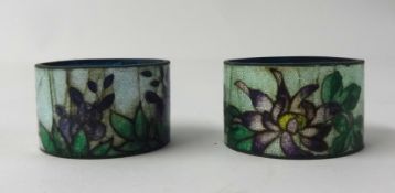A pair of enamelled serviette rings (some damaged) also a 1930s oblique 40s barbola work dressing