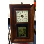 A Waterbury Clock Co, with 'OG' mahogany case, having two weights, 66cm x 39cm.