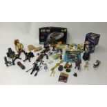 A collection of various Star Trek and Star Wars figures and memorabilia
