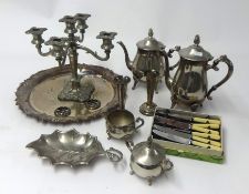 A collection of various silver plated wares including candelabra candle sticks trays etc.