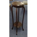 A early 20th century circular plants stand with 2 tiers and mahogany finished