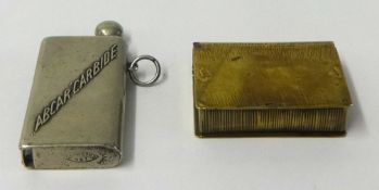 Brass Vesta and a carbide lighter (2).