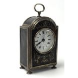 A Geo V silver tortoiseshell cased mantle clock, the white enamel dial set with roman numerals,