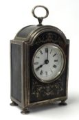 A Geo V silver tortoiseshell cased mantle clock, the white enamel dial set with roman numerals,