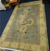 A modern wool rug of Chinese design, approx. 265cm x 180cm.