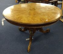 Victorian style  circular breakfast table with a walnut and marquetry inlaid top on a carved