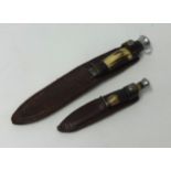 Two small English knives and leather scabbards