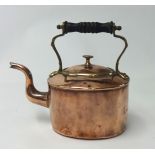 An early Victorian copper kettle with brass mounts and turned wood finial, height 22cm