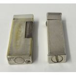 Two Dunhill Lighters including one stamped 'Cartier License'.