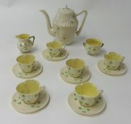 A Belleek porcelain tea service, circa 1950's, with 5th period green back stamp comprising 6 cups