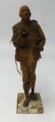Unusual Terracotta figure a man in silk dress and square plinth base, possibly 19th century.